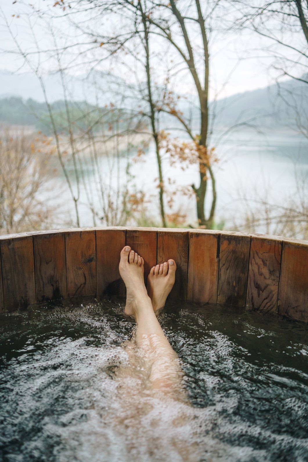 POV of female feet in the outdoor hot tub